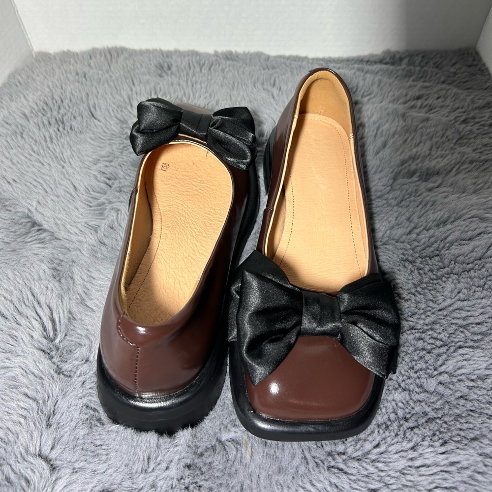 Elegant Brown Flats with Black Bow